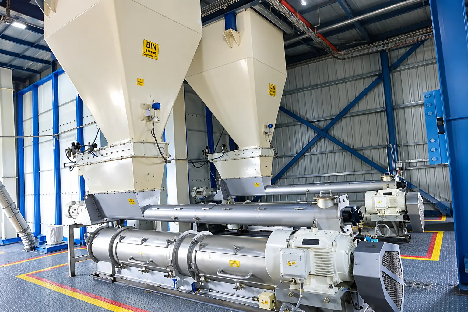 Ingredient dosing and conveying equipment inside the Quarit processing facility